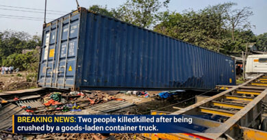 Two people killed after being crushed by a goods-laden container truck.